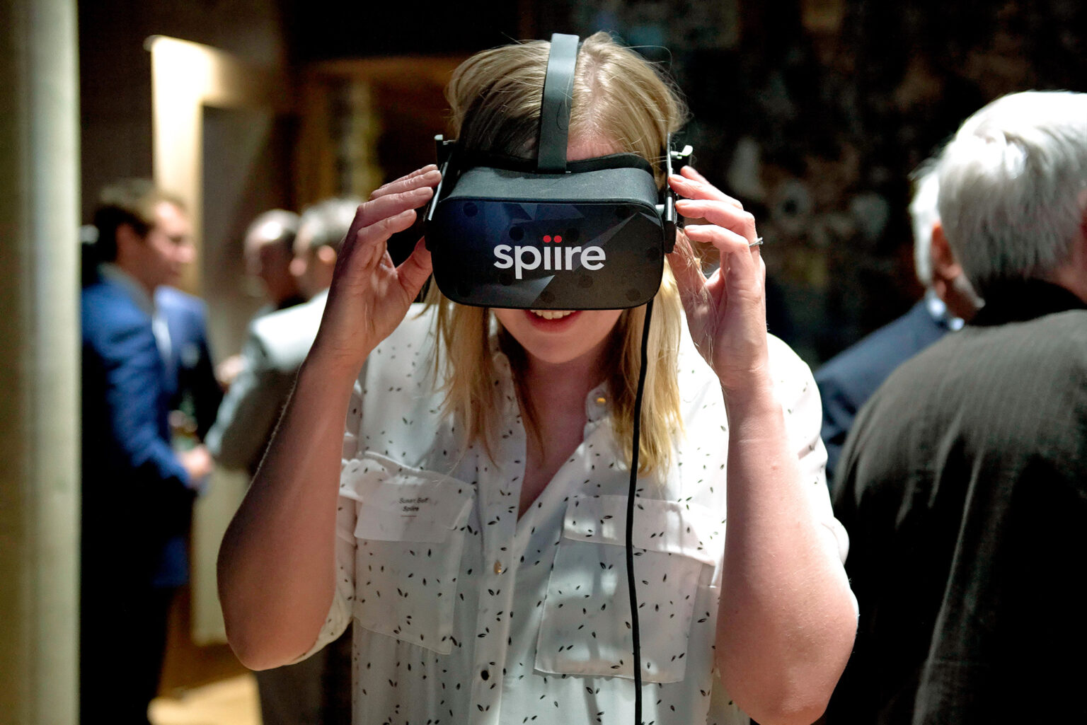 Consultant uses VR headset at Spiire event.