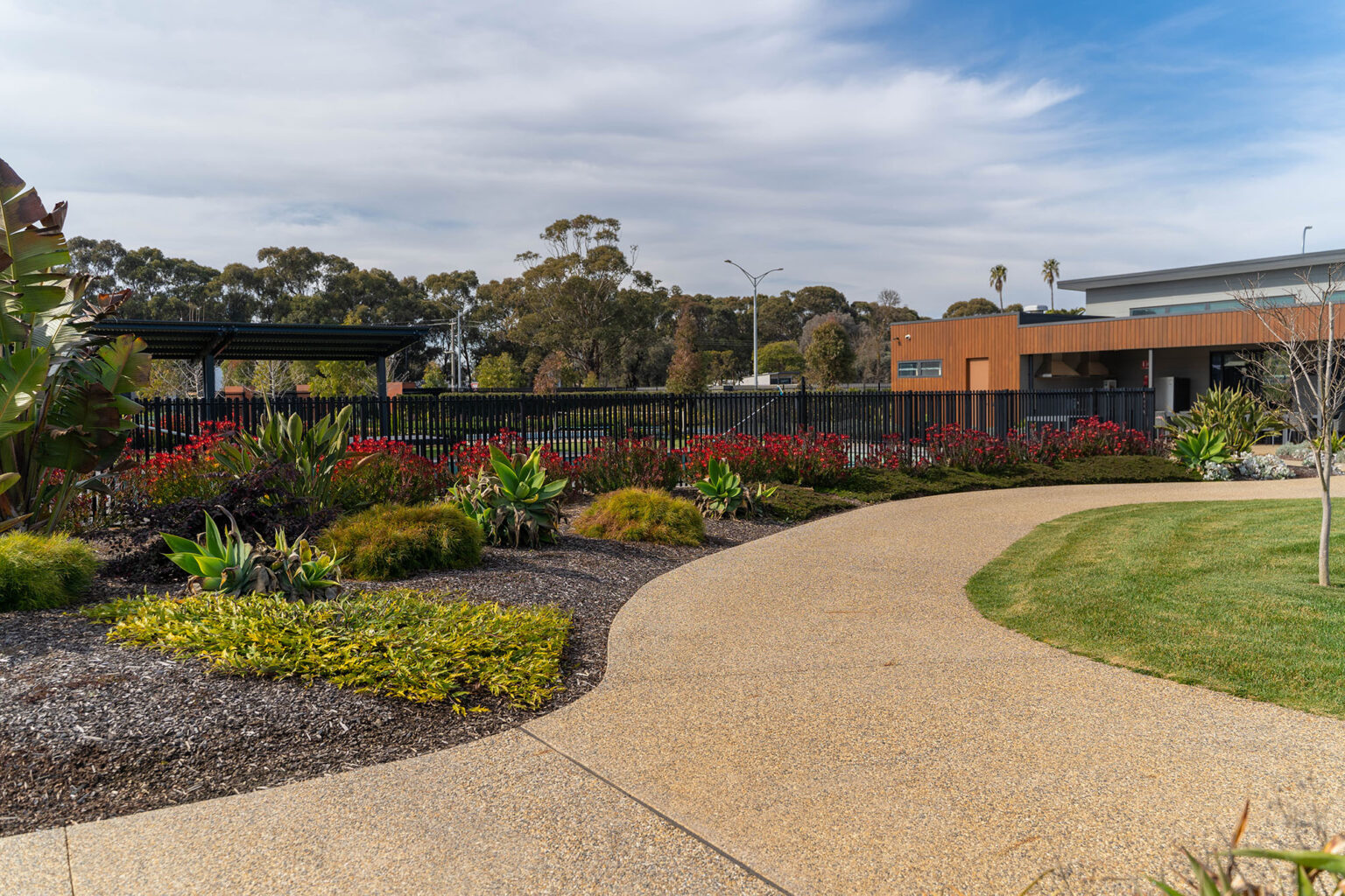 Colourful planting along pathways adjoining the resident facilities at Waterways Lifestyle Village.