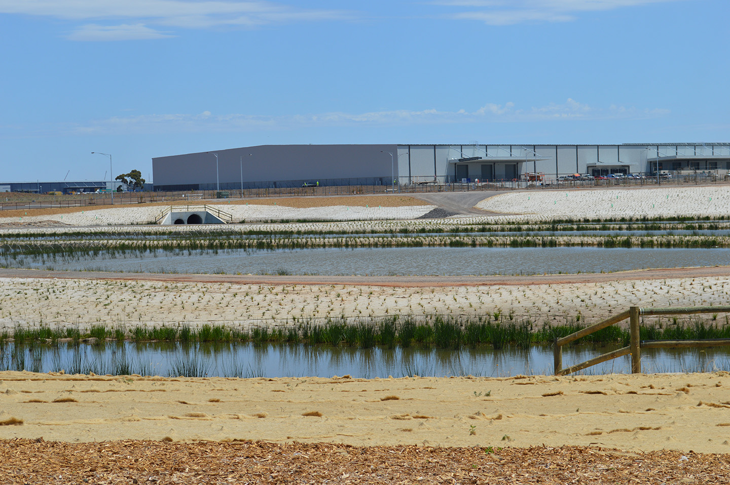 newly landscaped retarding basin as Dexus industrial park designed by spiire water engineers and landscape architects