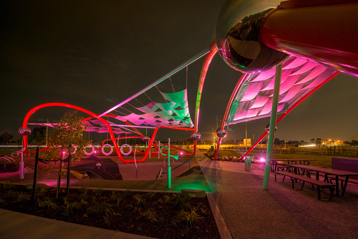 Entrance Park feature at Aurora Estate at night