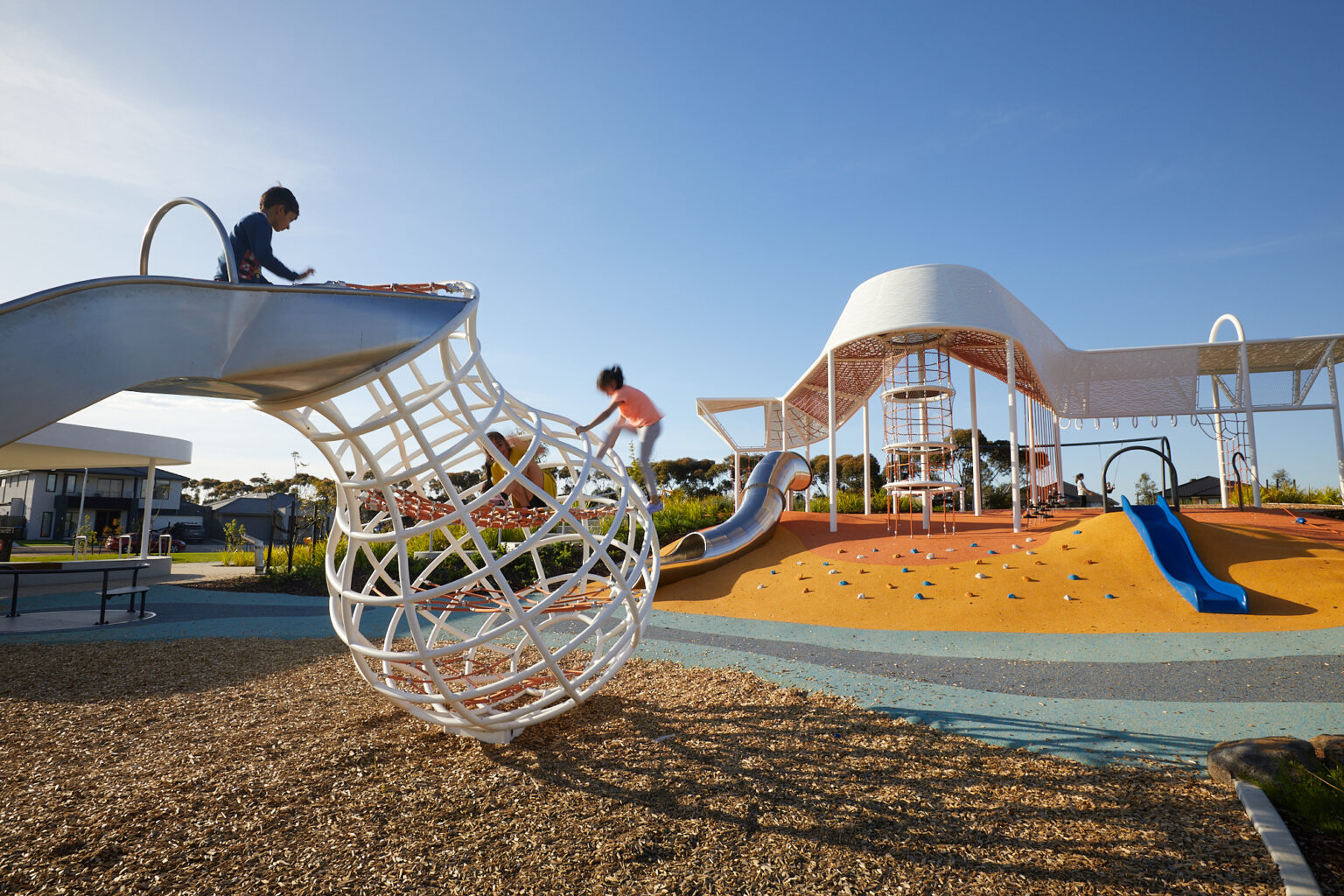 Children playing at Tributary Street Park, The Grove, designed by Spiire landscape architects.