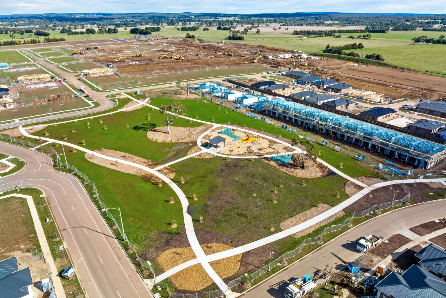 Aerial view of park with play equipment at Conroy's Green estate, with civil construction in the background.