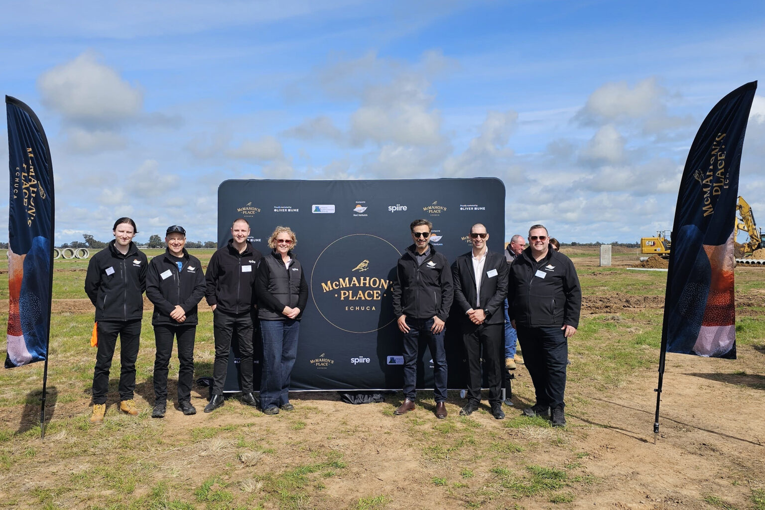 Civil engineer Jordan Doherty, town planner Jane Macey and wider project team at McMahon's Place sod turning event.
