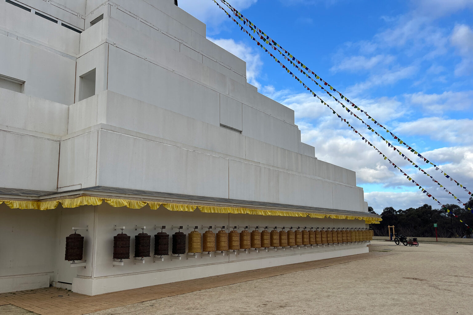 Prayer wheels along the exterior of The Great Stupa of Universal Compassion.